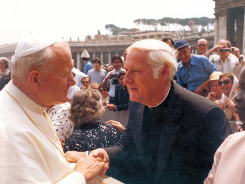 Father Mengeling shaking hands with Pope John Paul II.